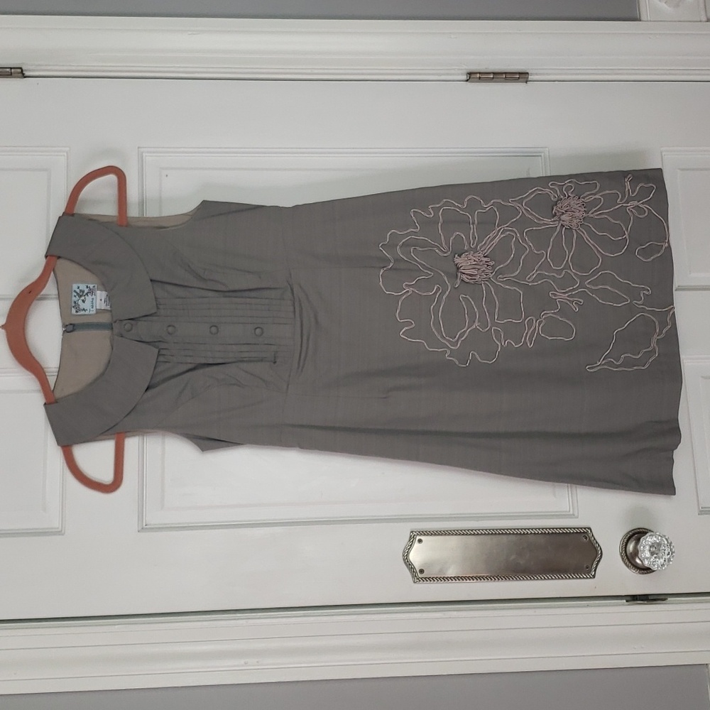 Gray above knee dress with beautiful flower embroidery on the skirt.